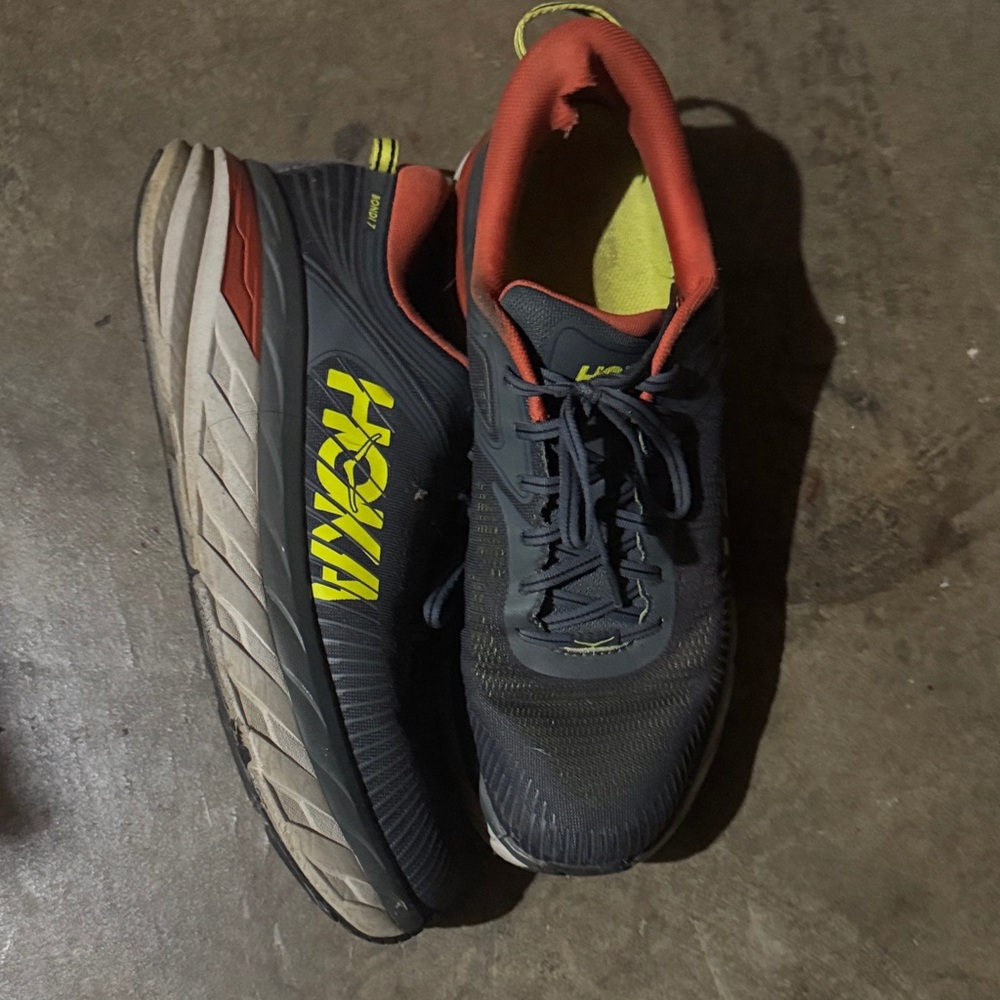 Hoka Men's Navy Athletic Shoes with Orange and Yellow Accents